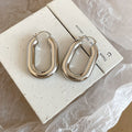 Silver Tone Sculpted Oval Hoop Earrings Matching Jewelry Pair view 6