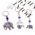 Silver Tone Elephant and Dolphin Blue Evil Eye Split Ring Keychains view 1