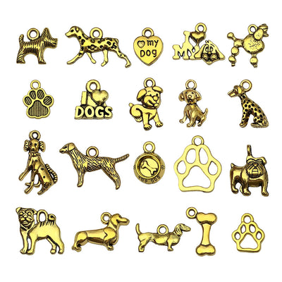 Gold-tone dog charms arranged on a light background