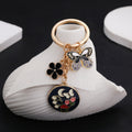 Black or Pink Butterfly Flower and Mushroom Keychains view 1