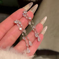 Silver Tone Crystal Heart Linear Drop Earrings with Decorative Accents view 1