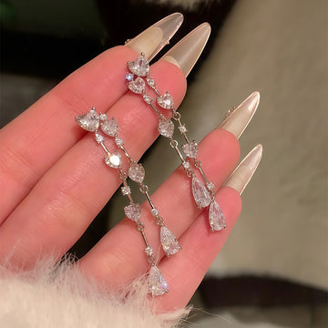 Silver Tone Crystal Heart Linear Drop Earrings with Decorative Accents
