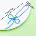 Butterfly Charm Keychains Featuring Magenta Bow Across 17 Pictured Variations view 7