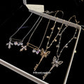 Butterfly and Cross Charm Necklaces in Four Mixed Designs view 1