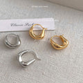 Rounded Geometric Huggie Hoop Earrings In Gold And Silver Tone view 1