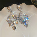 Silver Tone Crystal Geometric Drop Stud Earrings With Decorative Metal Accents view 7