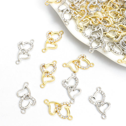 Assorted double heart connectors arranged on a white background