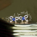 White Metal Bow Stud Earrings Blue Oval Center Pavé Stones view 4