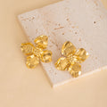 Thirty-Five Gold Tone Floral and Sculptural Stud Earrings view 2