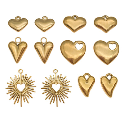 Gold-tone heart charms arranged on a light background
