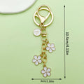 Gold-Tone Initial Letter Keychain With Three Flower Charms view 7