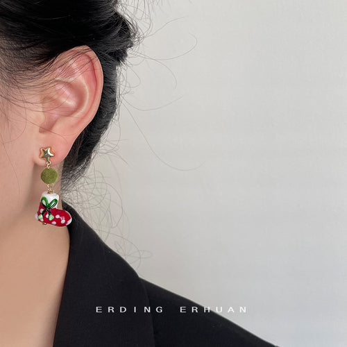 Christmas stocking drop earring worn on ear side profile
