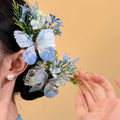 Blue Fabric Butterfly Floral Spray Hair Clip Green Foliage view 1