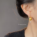 Matte Gold Bell Flower Drop Earrings Clear Teardrop CZ view 2