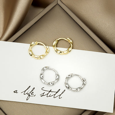 Primary supplied view of textured molten-look small hoop earrings