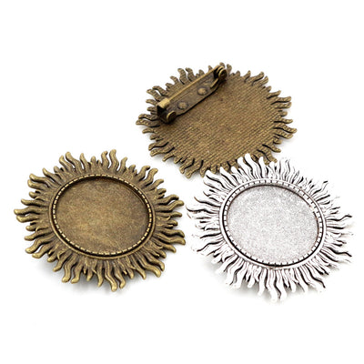 Sunflower Round Cabochon Brooch Bases in Antique Bronze and Silver shown in a grouped front view