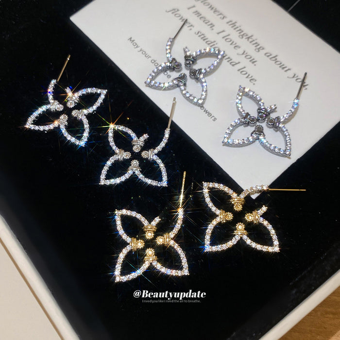 Open Flower Outline Stud Earrings in Gold and Silver