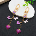 Purple Heart Butterfly and Carousel Metal Clasp Keychain Set view 3