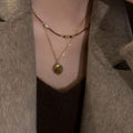 Gold Tone Layered Necklace with Brown Oval Pendant view 3