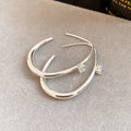 Open Oval Hoop Earrings with Crystal Accent in Silver Tone view 6