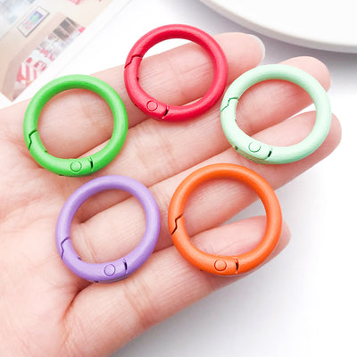 Colorful spring clasp jewelry findings shown in a close-up product view