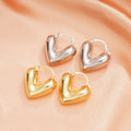 Gold and Silver Tone Heart Huggie Earrings Polished Jewelry Accessory view 1