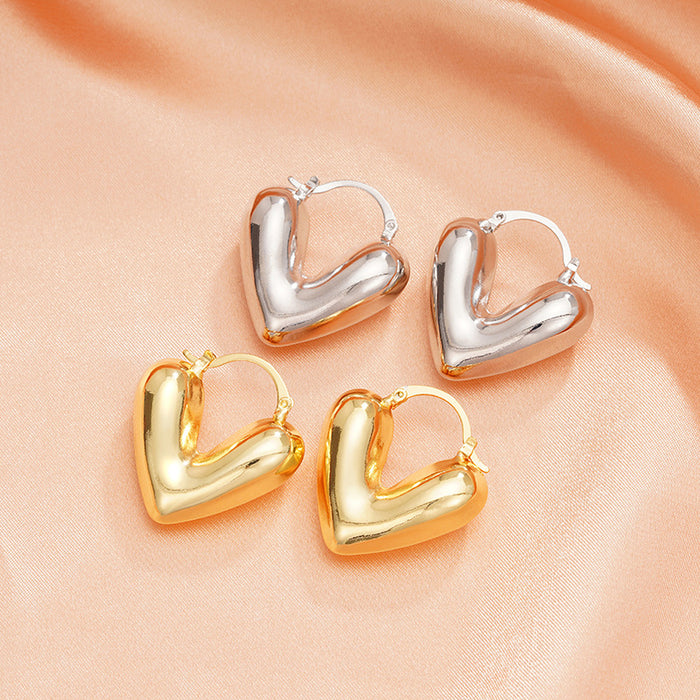 Gold and Silver Tone Heart Huggie Earrings Polished Jewelry Accessory