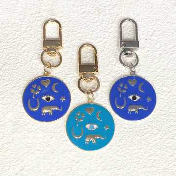 Gold Tone Round Enamel Eye and Celestial Clip Keychains