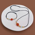 Red Agate Bead Black Cord Necklace Gold Wire Accent Beads view 1