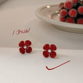 Glossy Red Flower Stud Earrings With White Pearl Centers view 3
