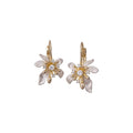 White Floral Hoop Earrings with Gold Tone Leaf Details view 5
