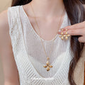 Gold Four-Petal Flower Necklace and Matching Earrings view 3