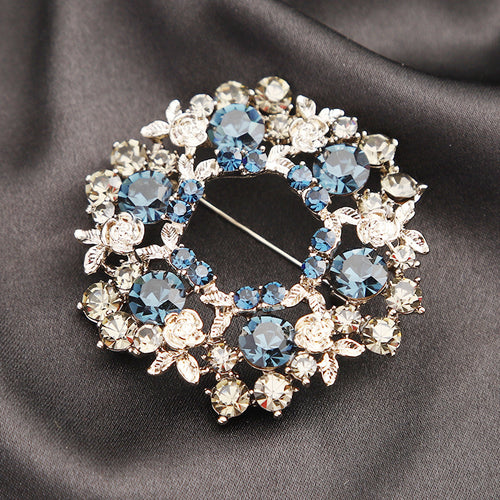 Blue and Clear Crystal Wreath Brooch in Silver Tone front view on a white background