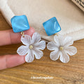 Blue Square and White Flower Drop Stud Earrings With Gold Tone Centers view 2