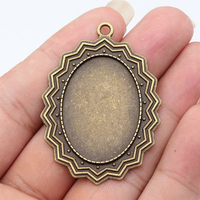 Front view of layered oval settings in the pictured finish
