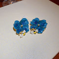 Blue Floral Statement Stud Earrings With Polished Metal Tone Details view 3
