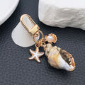 Four Gold Tone Shell Starfish and Pearl-Look Clasp Charms for Accessory Making view 4