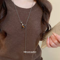 Silver Tone Chain Necklace with Brown Vase Pendant view 3
