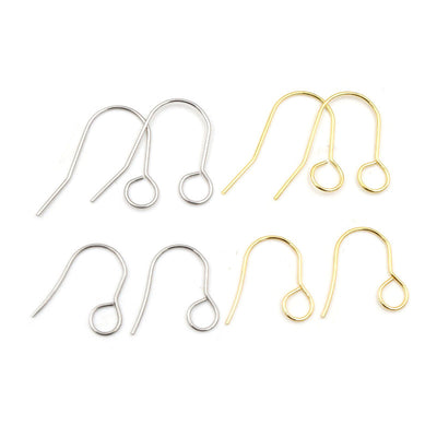 Overview of slim fishhook earring wires with open round attachment loops on a light background