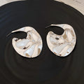 Sculpted Wavy Disc Stud Earrings in Gold and Silver Tone view 7