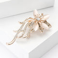 Crystal Floral Spray Brooch With Polished Metal And Sculpted Decorative Details view 2