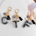 Shell-Chip Resin Letter Keychain with Evil Eye Charm and Tassel view 1