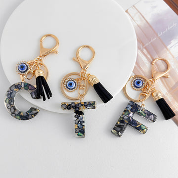 Black Flecked Letter Keychains with Evil Eye Charm and Tassel