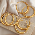 Thick Polished Large Metal Hoop Earrings Gold Or Steel Tone view 2