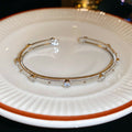 Silver Crystal Leaf Cuff And Textured Gold Or Silver Open Bangles view 8