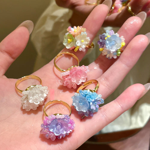 assorted multicolor beaded flower cluster rings held together