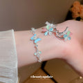 Silver Blue Butterfly Slider Bracelet and Flower Hoop Earrings view 1