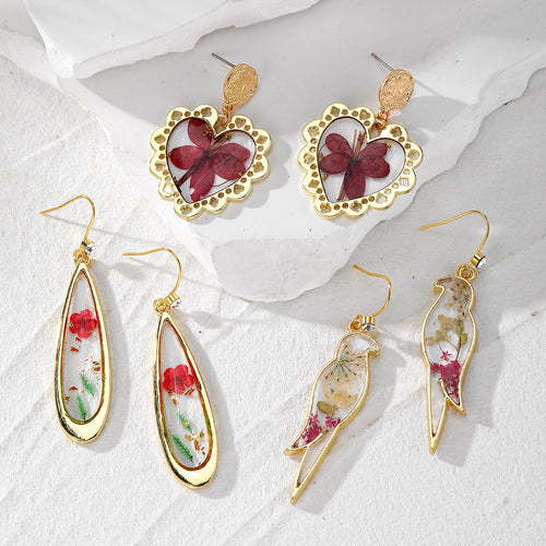 Main product view of gold Tone Pressed Flower Resin Drop Earrings in Three Designs