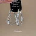 Layered Heart Outline Hoop Earrings in Silver Tone view 4
