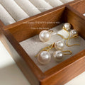 Gold Tone Hook Earrings With White Pearl Drops In Three Sizes view 4